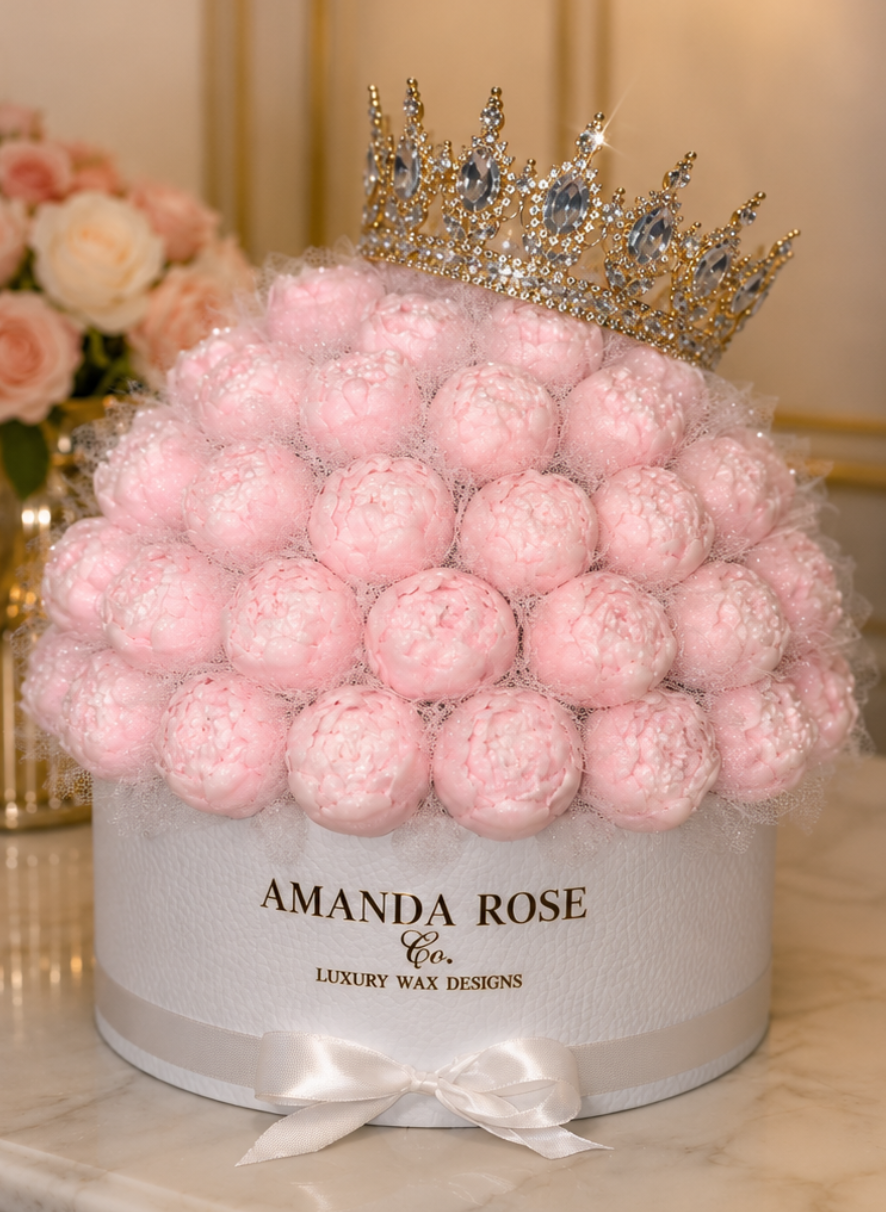 Box of pink wax melts with a crown on top, branded 'Amanda Rose Co.'