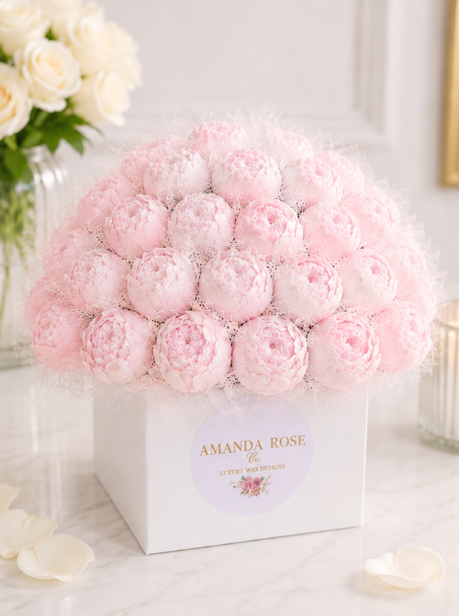 Pink roses in a box with 'Amanda Rose' branding on a light background